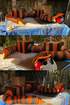 Outdoor decorations made from air duct tubing, wooden boxes, Styrofoam and fabric. Tubing put through boxes then held in place with great stuff and Styrofoam pieces. Painted orange and black stripes. Mouth made from fabric and coat-hangers attached with zip ties and hot glue. Tail made from fabric and great stuff attached with hot glue. Bear shoved in mouth. Step by step instructions via Kie & Craigs Crazy Craft Corner on YouTube. Nightmare Before Christmas Games, Jack Skellington Santa, Sandy Claws, Santa Claws