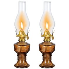 a pair of antique style lamps with glass shades