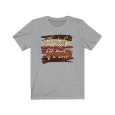 "\"Thankful and blessed but kind of a mess\" t-shirt This trendy fall shirt with autumn brush strokes is a perfect way to show your love of fall and all the colors of the fall season. This adorable fall shirt with a funny saying will be a great addition to your fall wardrobe. Wear this fall t-shirt with a pair of jeans, boots and a jacket or cardigan and you'll be stylin' for the season. CARE INSTRUCTIONS Design is professionally transferred using commercial grade equipment for a beautiful and d Inspirational Crew Neck T-shirt For Fall, Fall Soft-washed Tri-blend T-shirt, Soft-washed Tri-blend Fall T-shirt, Inspirational Graphic Print T-shirt For Fall, Inspirational Cotton T-shirt For Fall, Instructions Design, Lyric Shirts, Blessed Shirt, Fall T Shirt