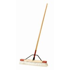 a broom with a wooden handle on a white background