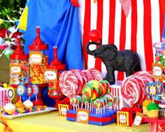 a circus themed dessert table with candy, candies and an elephant figurine