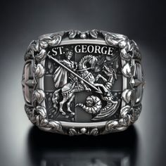 Celebrate the triumph of good over evil with our Saint George the Victorious Knight Cross Christian Signet, crafted from high-quality 925 sterling silver. This exquisite ring features a detailed depiction of Saint George, the legendary knight who symbolizes courage, honor, and faith, slaying the dragon. The Christian cross adds a touch of spiritual significance, making it a perfect piece for those who cherish their faith and values. The adjustable band ensures a comfortable fit for any finger si Cross Christian, Viking Ring, Masonic Ring, Retro Ring, Animal Rings, Chunky Rings, Christian Cross, Everyday Rings, Cross Ring