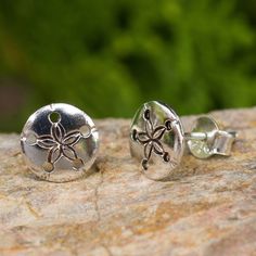 Petite silver sand dollars grace these charming earrings from Wadarat Supasirisuk. Crafted by hand they are a perpetual reminder of days at the seashore. .925 Sterling silver Sand Dollar Earrings, Seashell Design, Sand Dollars, Silver Button, Silver Anklets, Button Earrings, Sand Dollar, Gifts For My Sister, Silver Buttons