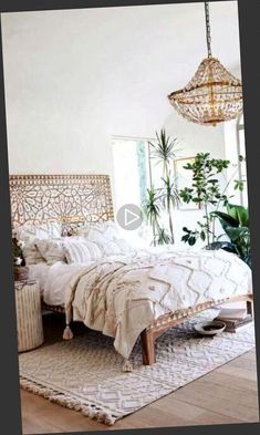 a bedroom with a bed, rug and plants in the corner on the wall next to it