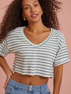 This not-so-basic basic is featured in a cropped, relaxed fit with a v-neckline and striped pattern. With a drop shoulder fit, cuffed sleeve, and textured pattern, this top is sure to take your basics collection to the next level. Spring Trendy V-neck Cropped T-shirt, Casual V-neck Cropped T-shirt For Summer, Striped Relaxed Fit V-neck Tops, Striped Ribbed Cropped Tops, Casual Cropped V-neck T-shirt For Summer, Summer V-neck Cropped T-shirt, Trendy V-neck Cropped T-shirt For Spring, Relaxed Fit V-neck Crop Top, Casual Striped Crop Top