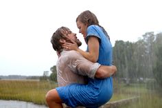 two people in the rain hugging each other