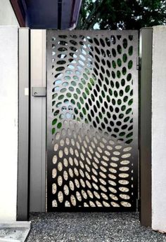 an open metal gate with circles on it