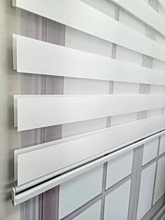 the blinds are closed and ready to be used in an office or home area,