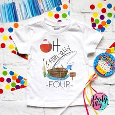 a white shirt with the words fish - ally four on it next to balloons and streamers