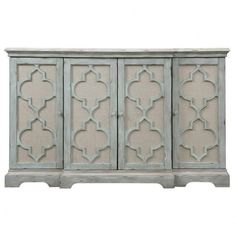 an antique style cabinet with four doors