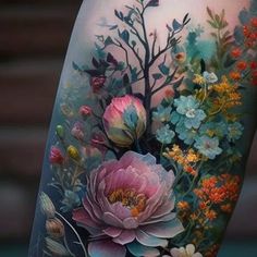 an arm with flowers and leaves on it