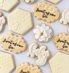 decorated cookies that say sweet as can bee and honey with the words sweet as can bee on them