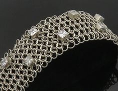 925 Sterling Silver - Vintage Cubic Zirconia Circle Link Chain Bracelet - BT7223  925 Sterling Silver - Vintage Cubic Zirconia Circle Link Chain Bracelet - BT7223  Jewelry Type:         Bracelet   Metal Type:            925 Silver  Metal Size:             7.25"  Length  1.75" Height   Stone Type:            Cubic Zirconia   Condition:              N/A  Jewelry Weight:     73 Grams  PLEASE NOTE: THIS ITEM IS PRE-OWNED. ALTHOUGH MOST ITEMS ARE IN VERY GOOD CONDITION, SOME MAY NEED CLEANING AND/OR Modern Sterling Silver Cubic Zirconia Bracelet, Modern Sterling Silver Bracelet With Diamonds, Silver Diamond Bracelet With 17 Jewels, Silver Sparkling Chain Bracelet Gift, Silver Sparkling Chain Bracelet For Gift, Sparkling Silver Chain Bracelet Gift, Fine Jewelry Silver Chain Bracelet With 17 Jewels, Silver Chain Bracelet For Anniversary, Modern Silver Bracelets With Sparkling Stones