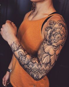 a woman with a tattoo on her arm