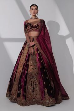 Burgundy pure silk velvet kalidar lehenga with zardosi hand embroidered mughal art and floral motifs. Paired with coordinating blouse and pure silk organza dupatta. - Aza Fashions Embroidered Velvet Wedding Lehenga, Festive Embroidered Velvet Lehenga, Desi Bridesmaids Outfits, Maroon Bridal Lehenga Velvet, Luxury Burgundy Dupatta With Resham Embroidery, Bridal Lehenga Maroon, Red Embroidered Velvet Lehenga, Cape Lehenga, Velvet Lehenga