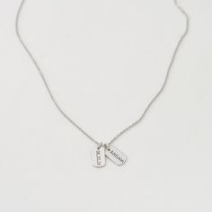 "Dainty Name Tag Necklace with engraved names of your choice. The tag can be personalized with .. - your children or grandchildren name - special date - initials of yourself and a loved one - roman numerals.... the ideas are endless! D E T A I L S - Tag size: 12mm x 7mm/ 0.47\" x 0.27\" - Custom engraved names - Tags can be engraved on one side or both sides --> choose from the drop down menu. - This listing is for ONE necklace. - Each piece or set comes in a gift box, ready for gifting. E N Adjustable Engraved Charm Necklace Best Friend Gift, Engraved Adjustable Charm Necklace For Best Friend, Personalized Stainless Steel Dog Tag Necklace, Everyday Stamped Dog Tag Necklace, Adjustable Nickel Free Dog Tag Necklace, Personalized Laser Engraved Dog Tag Jewelry, Engraved Pendant Charm Necklace For Best Friend, Engraved Pendant Charm Necklaces For Best Friend, Personalized Dog Tag Necklace With Engraving