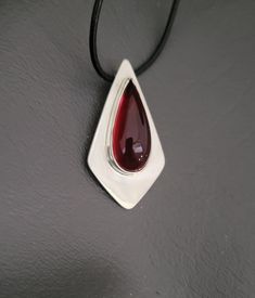 "This is a wonderful piece of rosarita bezel set in sterling silver.  The pendant has a hidden bail and comes with an 18\" leather cord.  Rosarita is a unique material which derives its exceptionally rich, red color from the process of gold refining.  The base material is silica mixed with gold at high temperatures.  Colors can range from a rich red to a rich orange." Gold Refining, Sea Glass Crafts Jewellery, Silversmithing Jewelry, Diy Jewelry Pendants, Bezel Set Necklace, Metal Jewelry Making, Mens Silver Jewelry, Handmade Silver Jewellery, Metalsmithing Jewelry