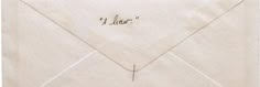 an envelope with writing on the front and bottom flap, inside which is marked'i dear '