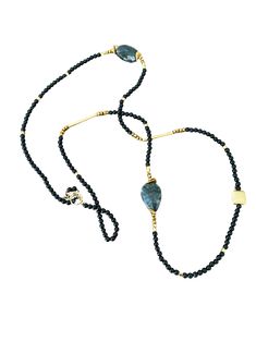 This asymmetrical necklace offers a unique and versatile design that can be worn long or double-wrapped for a shorter necklace style. The necklace showcases a combination of onyx gemstones, gold bars, and gold beads, creating an exquisite and eye-catching piece of jewelry. It measures approximately 40 inches in length, allowing for various styling options. The onyx gemstones are the focal point of the necklace, adding a rich and captivating deep black hue. Onyx is a semi-precious gemstone known Gold Onyx Gemstone Beaded Necklaces, Gold Onyx Beaded Necklaces With Gemstone Beads, Elegant Onyx Wire Wrapped Necklace, Gold Onyx Necklaces With Natural Stones, Gold Long Necklace With Gemstone Beads, Gold Long Necklace With Natural Stones, Elegant Gold Long Necklace With Natural Stones, Elegant Long Gold Necklace With Natural Stones, Asymmetrical Necklace