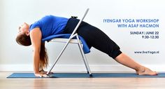 a woman is doing yoga on a chair