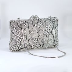 New to our Millennium collection, This beautiful romantic bridal clutch bag is made of very fine quality of rhinestones and metal and it comes with two chains, one chains length is 15 inches for a shoulder bag 45 inches long cross body bag Detachable chain for your Big day! Dimensions- Depth of the bag is 2 inches, length oh the bag is 7.5 inches and width of the bag is 4.5 inches.   ► ABOUT YOUR ORDER * All items are neatly packaged in our beautiful jewelry boxes and elegant organza bags. * All Rectangular Rhinestone Wedding Clutch, Rectangular Wedding Clutch With Rhinestones, Rhinestone Clutch Evening Bag For Wedding Guest, Rectangular Rhinestone Evening Bag For Wedding Guest, Rhinestone Clutch For Wedding Guest, Glamorous Wedding Evening Bag With Rhinestones, Elegant Wedding Clutch With Bling, Silver Crystal Clutch Bag, Silver Rhinestone Clutch Evening Bag