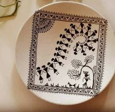 a white plate with black designs on it