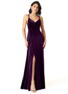 a woman in a long purple dress with a slit down the side and one leg