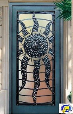 a decorative glass door on the outside of a house