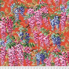 an orange background with pink and blue flowers