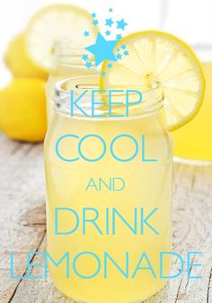 a mason jar filled with lemonade sitting on top of a wooden table