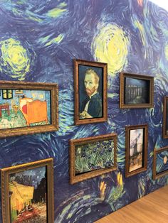 a wall with many paintings on it that is painted like van goghn's starry night