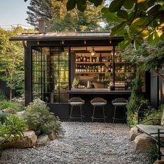 an outdoor bar in the middle of a garden