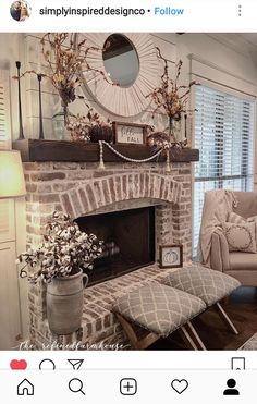 a living room filled with furniture and a fire place in front of a brick fireplace