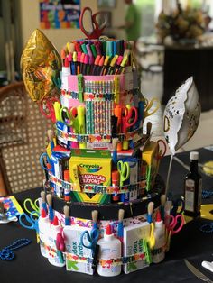 a stack of school supplies sitting on top of a table