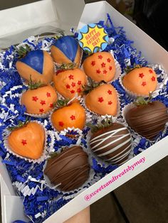 a box filled with chocolate covered strawberries and oranges