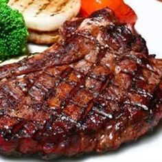 steak, potatoes and broccoli on a white plate