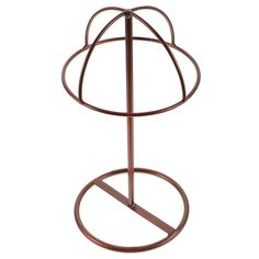 a round metal stand with two circular bars on it's legs, and an iron base