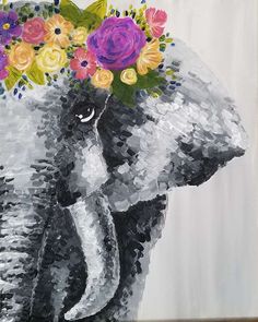 an elephant with flowers on it's head