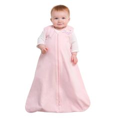 a baby wearing a pink sleeping bag