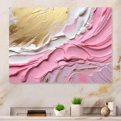 an abstract painting in pink, gold and white on a wall above a fireplace mantel