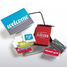 several small notebooks are placed next to each other on a white surface with the words, welcome and thank you