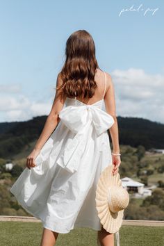 Elevate elegance to your spring wardrobe with the Alice Bow Back Midi Dress in White, featuring a stunning open-back design and feminine bow detailing ✨ The midi length and classic black hue make it the perfect dress for any occasion. Tap to shop this white bow midi dress now! Concert Outfit Summer, Resort Dresses, Floral Dresses Long, Usa Dresses, Bow Back, Dresses By Length, Long Sleeve Floral Dress, White Bow, White Midi Dress