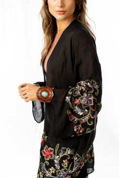 Nothing is more fun than a kimono covered in floral! This perfect layering piece features a sheer fabric in a longline silhouette with accents of crochet florals in multicolors along the hem and wide sleeves.Model is 5'8" and wearing a one size.100% Polyester OS sizing fits most* sizes US 0-18Length: 38 inBust Across: 25 inSleeve Length: 17 inSleeve Opening: 11 in Import Boho Outfits Bohemian, Ceremonial Clothing, Affordable Boho, Lace Sleeve Top, Boho Kimono, Sheer Fabric, Bohemian Clothes, Boho Women, Wide Sleeves