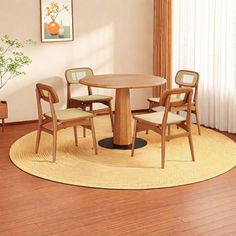 a round table with four chairs around it