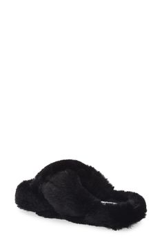 Plush faux fur straps and a footbed envelop your feet in comfort, allowing you to lounge in style. Polyester faux fur upper and lining/rubber sole Imported Casual Faux Fur Slippers With Plush Lining, Black Synthetic Slippers With Faux Fur Lining, Black Slippers With Faux Fur Lining, Casual Faux Fur Lined Slippers, Casual Faux Fur Slippers, Black Faux Fur Slippers For Winter, Black Faux Fur Slippers With Round Toe, Fluffy Faux Fur Slippers For Winter, Black Soft Synthetic Slippers