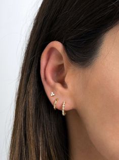 "Dainty and beautiful, these tiny studs are adorned with three bright prong-set cubic zirconia gemstones. An everyday staple piece, perfect for wearing in a first, second or third earhole or on a cartilage piercing for a dainty addition to your look. * Sold as a PAIR * D E T A I L S * ∙ Material: .925 Sterling Silver or 18K Gold Plated over .925 Sterling Silver ∙ Stone: White Zirconia ∙ Dimensions: 4mm ∙ Hypoallergenic & nickel-free * P A C K A G I N G * ∙ All jewelry is sent out beautifully Three Ears Pierced, Three Hole Ear Piercing Earrings, 3 Earrings Piercing In A Row, Third Stud Earrings, Earrings Three Holes, 3 Earrings Piercing Ideas, 3 Ear Piercings Gold, Ear Piercings 3, Gold Earrings Three Holes