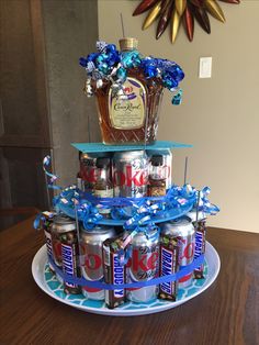 a cake made to look like cans with blue ribbons