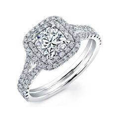 a diamond engagement ring with two rows of diamonds on the band and an intricate halo setting