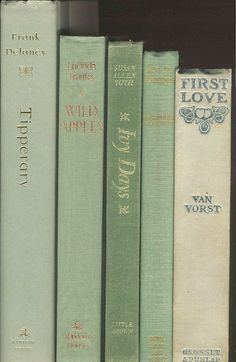 a row of books sitting on top of a shelf