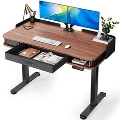 a computer desk with a monitor and keyboard on it, sitting in front of a white background